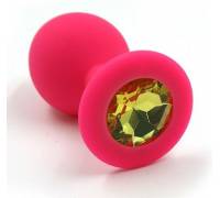 Розовая силиконовая анальная пробка с жёлтым кристаллом - 7 см.
