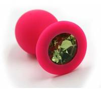 Розовая силиконовая анальная пробка с светло-зеленым кристаллом - 7 см.