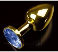 Золотистая анальная втулка с синим стразом - 7 см.